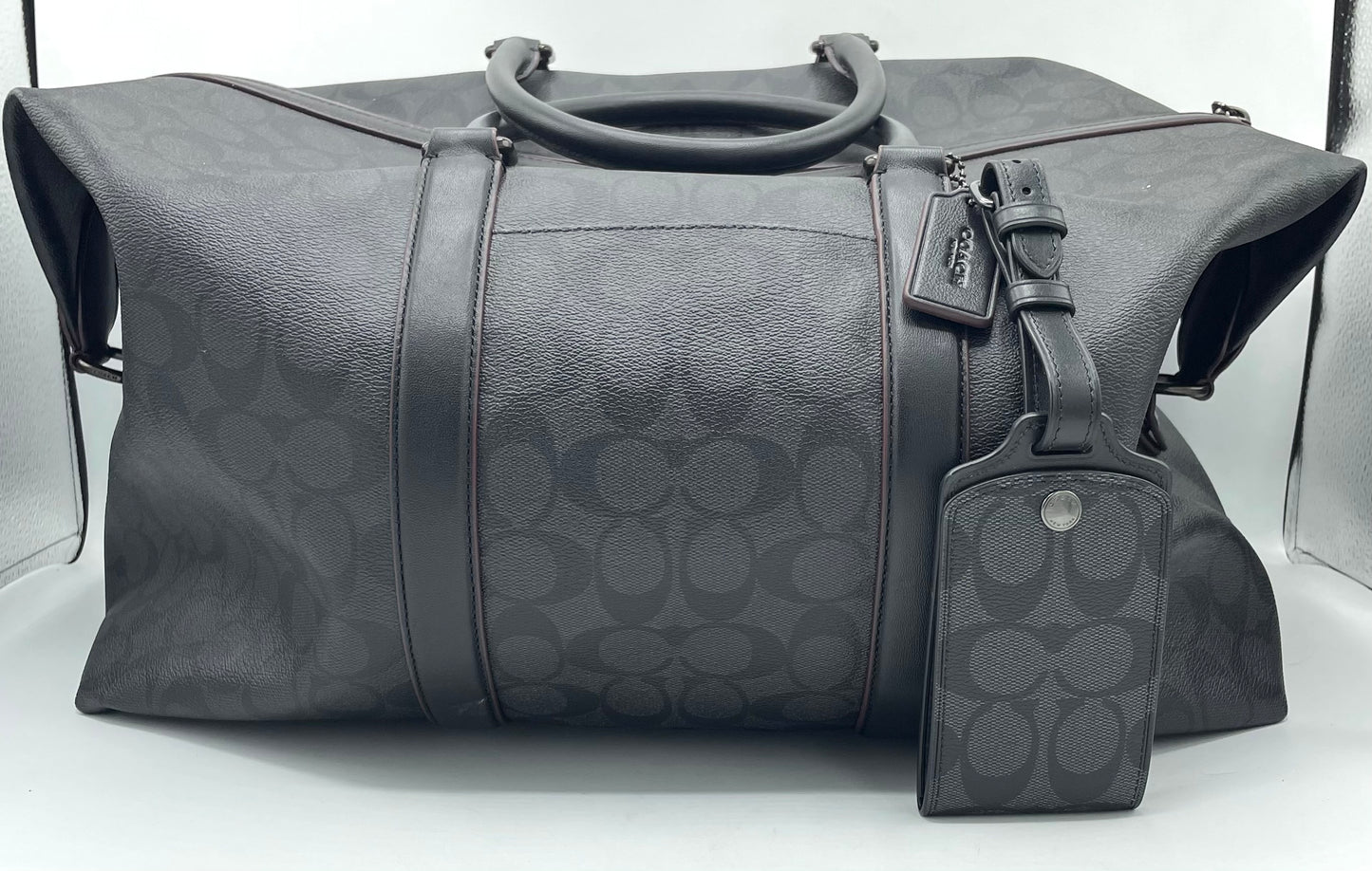 Coach Trekker Duffle – Signature Canvas with Oxblood Accents