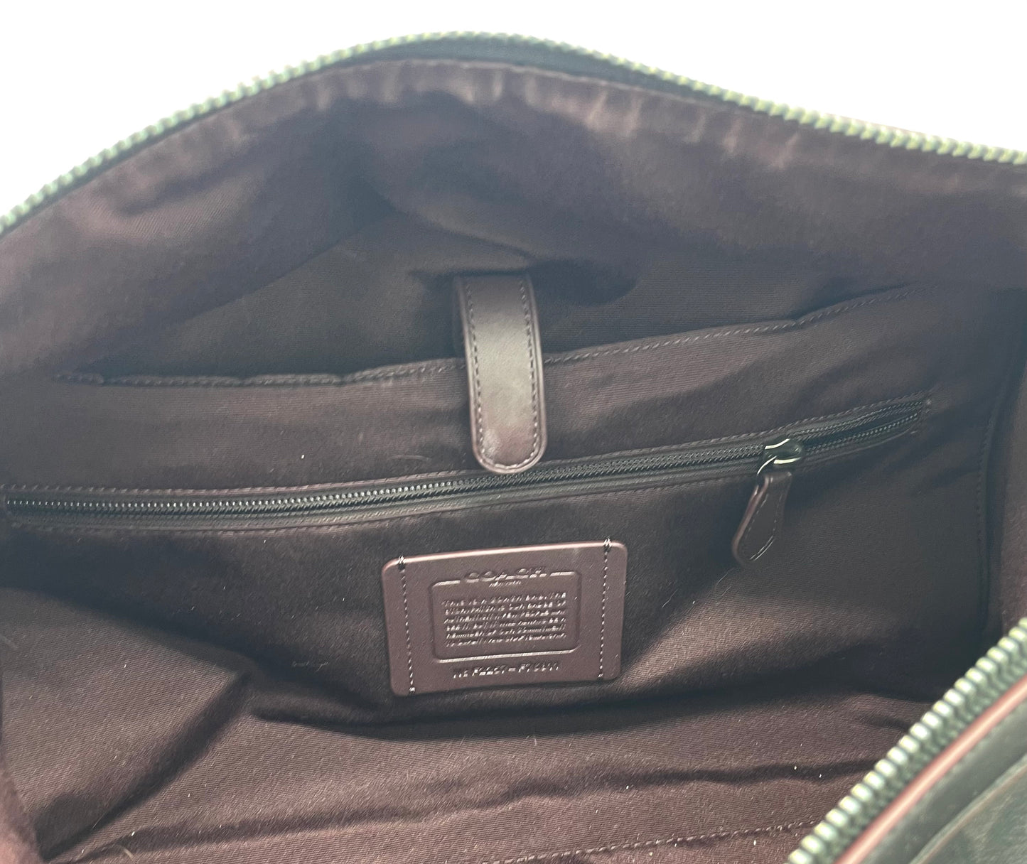 Coach Trekker Duffle – Signature Canvas with Oxblood Accents